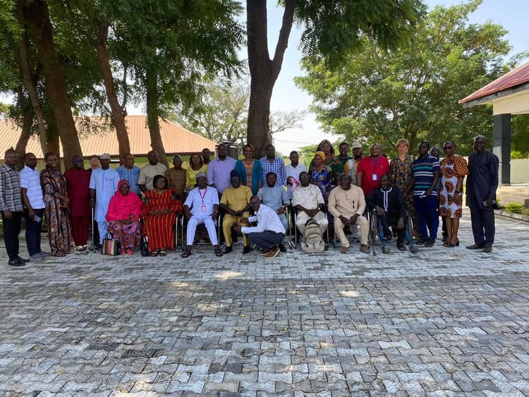 group picture of stakeholders including women and men