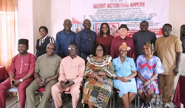 group picture of stakeholders including women and men